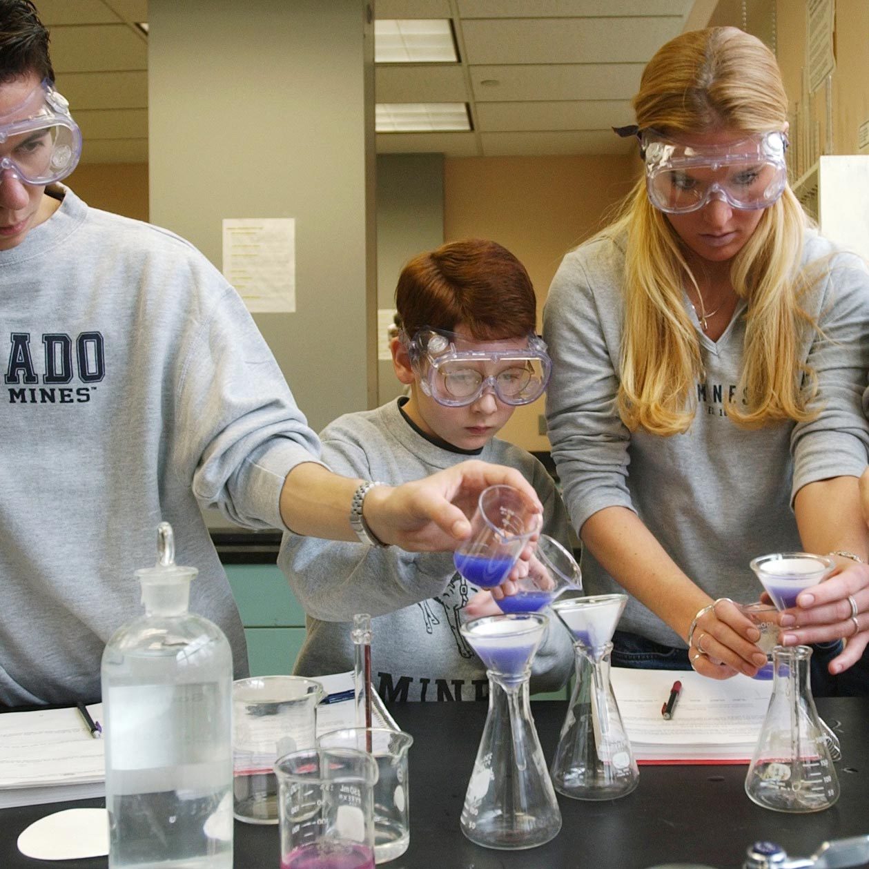 Left to right: Colorado School of Mines freshmen students: Kyle Sanoval,19, Dylan Jones, 10 years-old, Cristin Cammon, 18, and Amanda Savage, 19, work together during a Chemistry 101 lab at the school in Golden on Tuesday, December 4, 2001. They were perf
