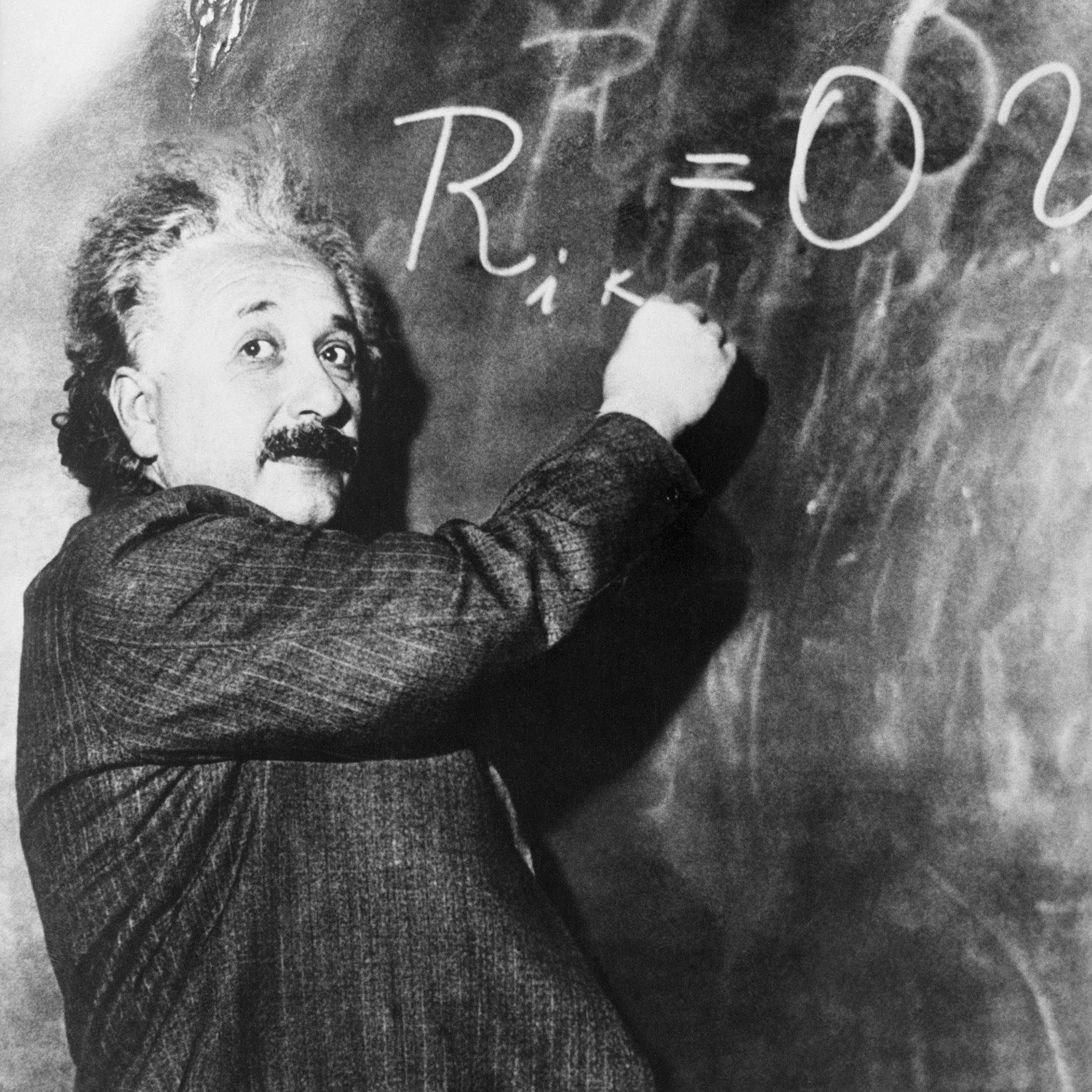Einstein Writing Equation on Blackboard