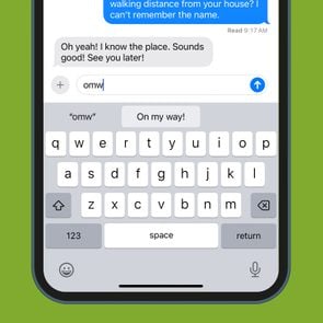 iphone keyboard shortcuts while texting screenshot on a phone on a green background