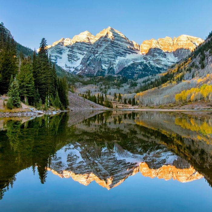 Snowcapped Maroon Bells Mountains With Reflection and Fall Foliage Aspen Colors at Sunrise