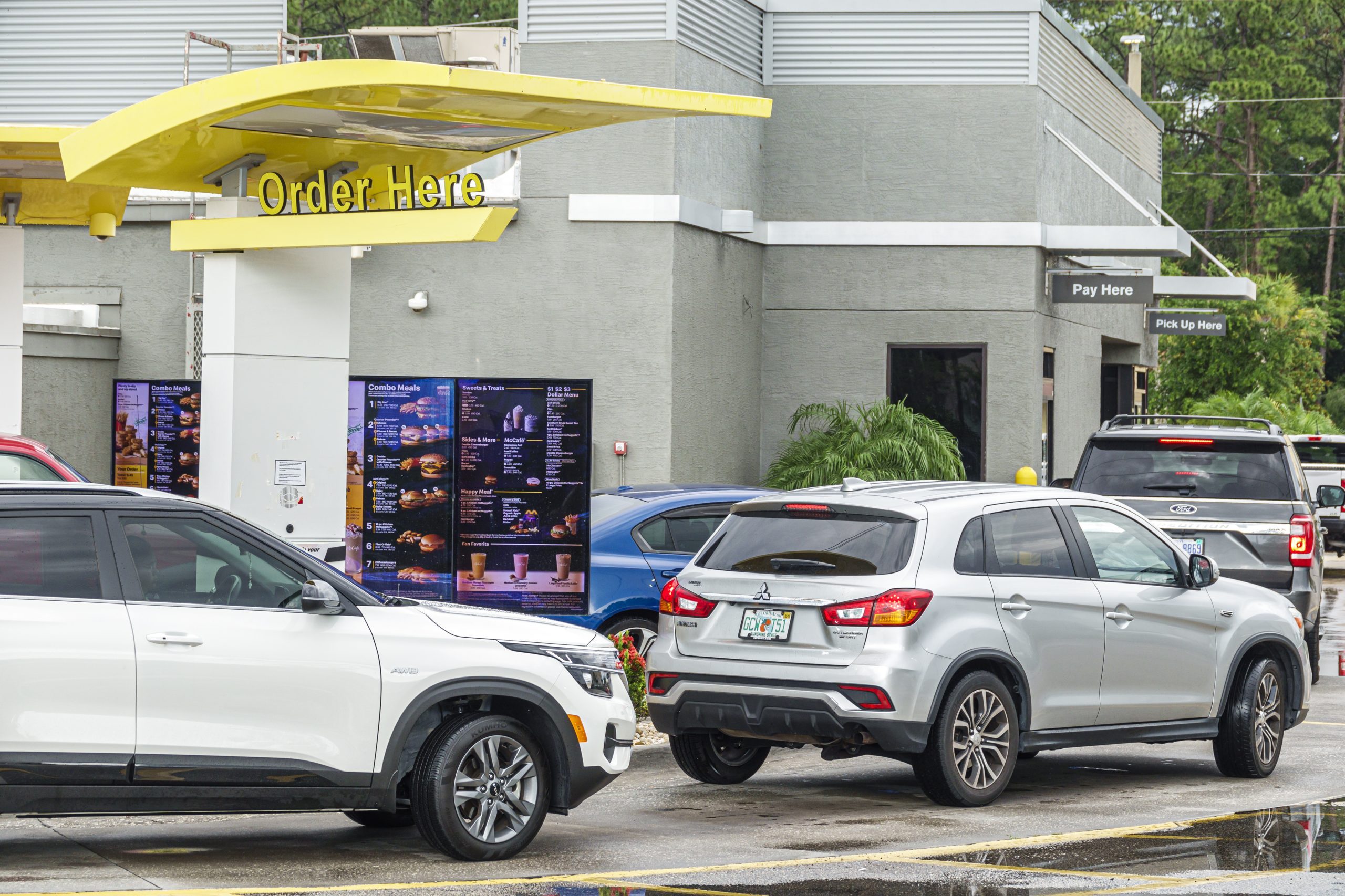 Sanford, Florida, McDonald's Restaurant drive thru order area, with line of cars