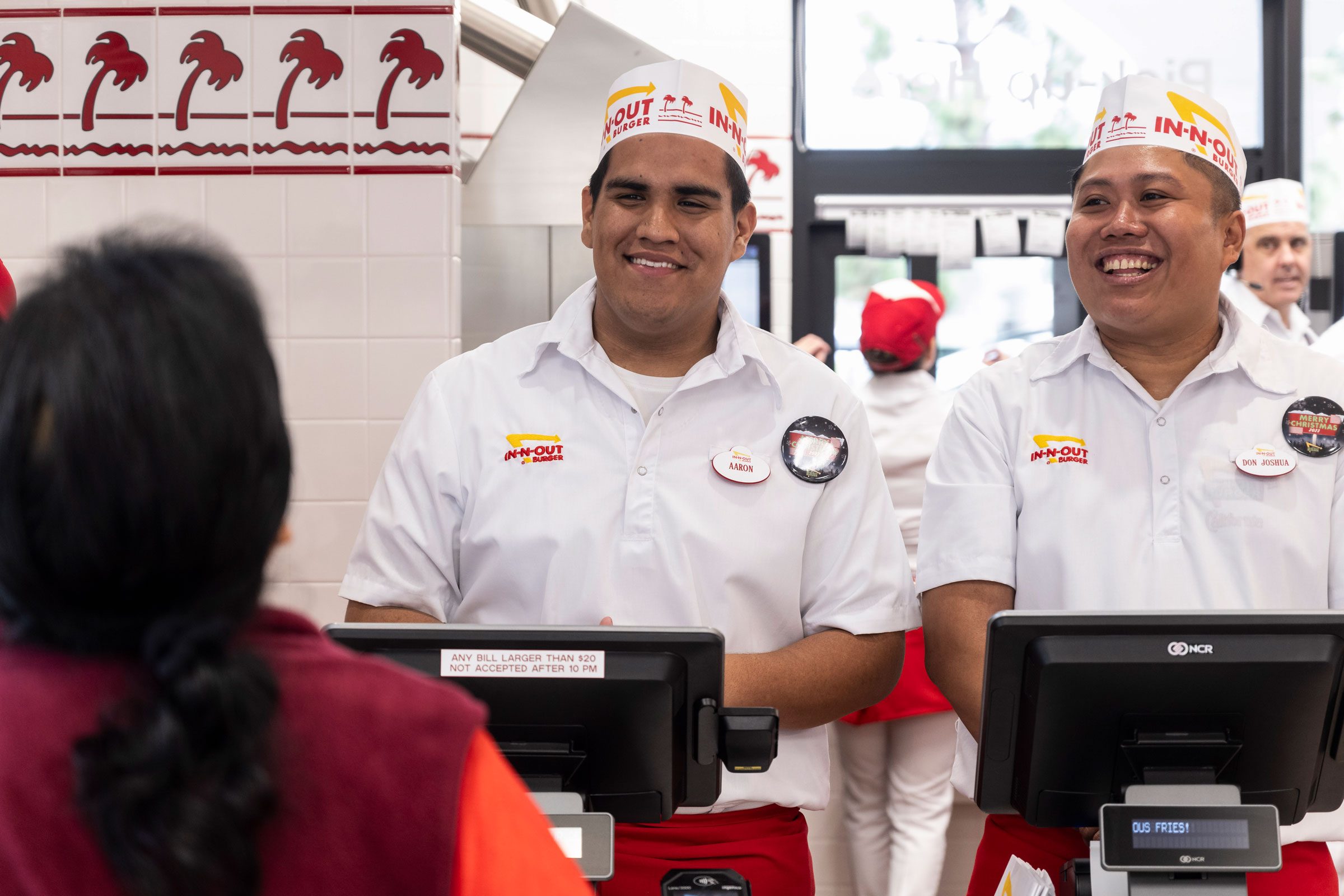 In-N-Out Burger employees laughing as customer orders