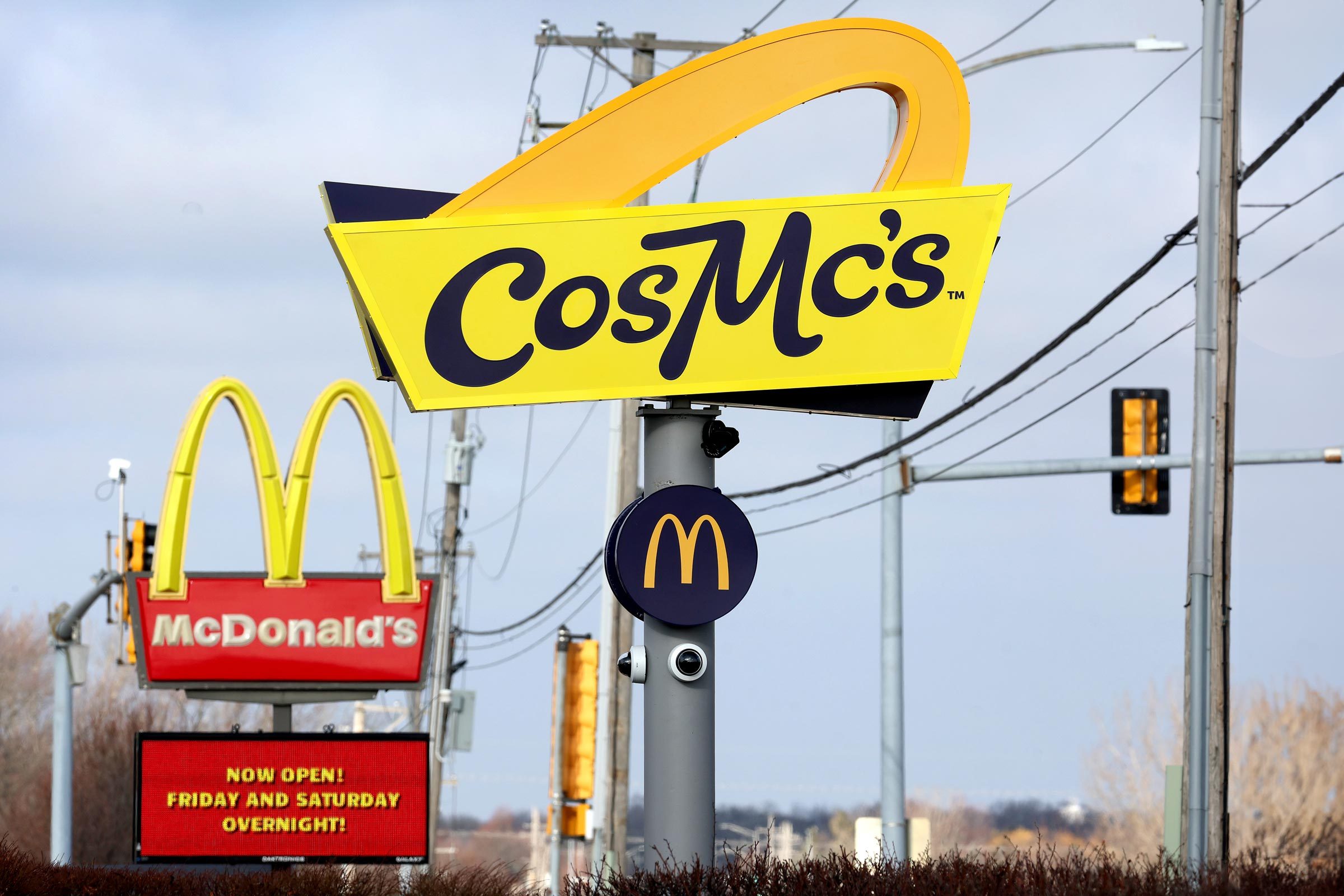 Cosmcs street sign and mcdonalds sign in the background