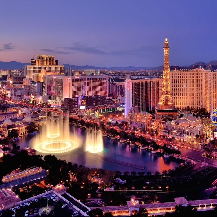 City skyline at night with Bellagio Hotel fountains, Las Vegas, Nevada, USA