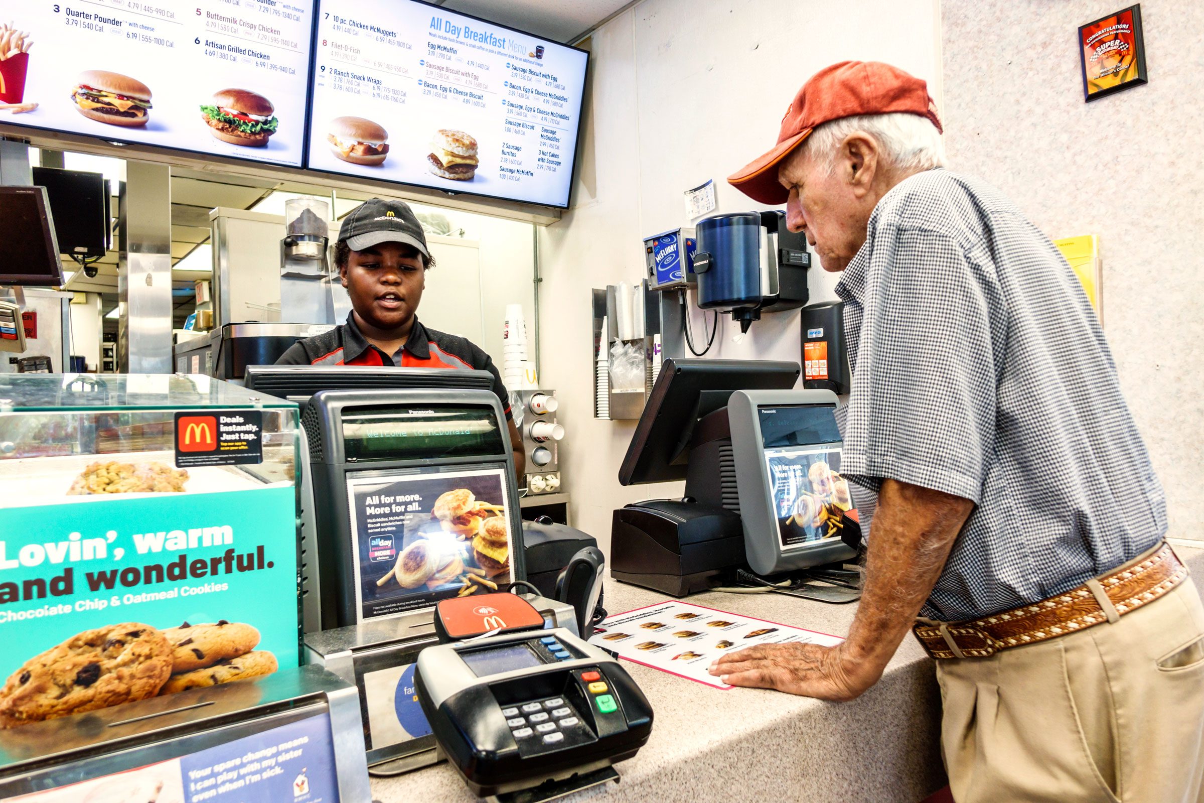 man ordering at Mcdonalds counter