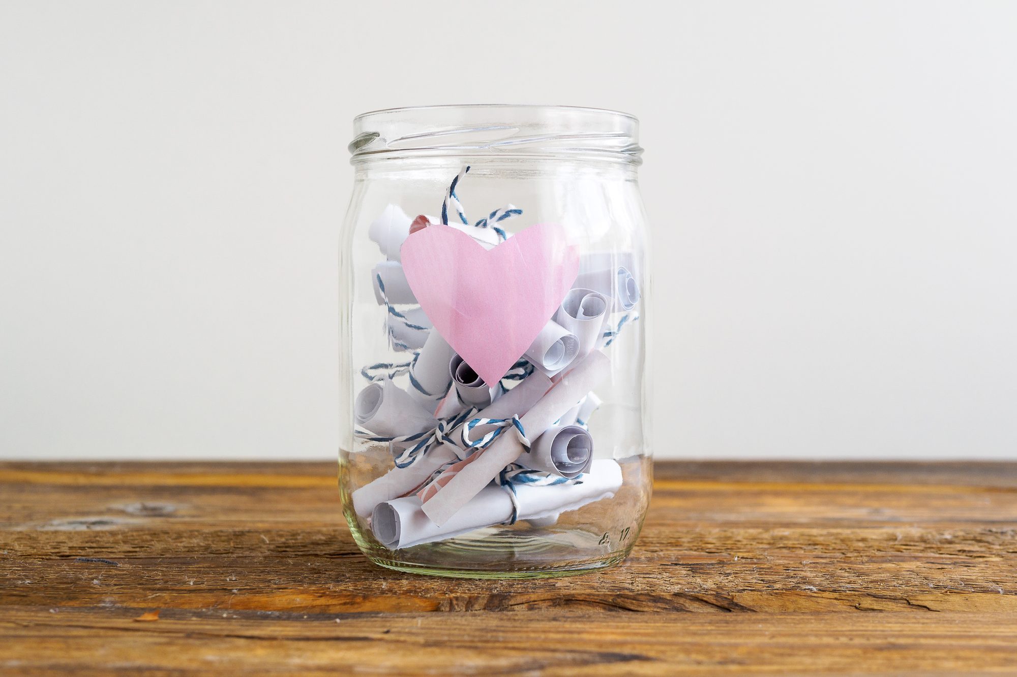 Jar with roas heart and rolled up notes