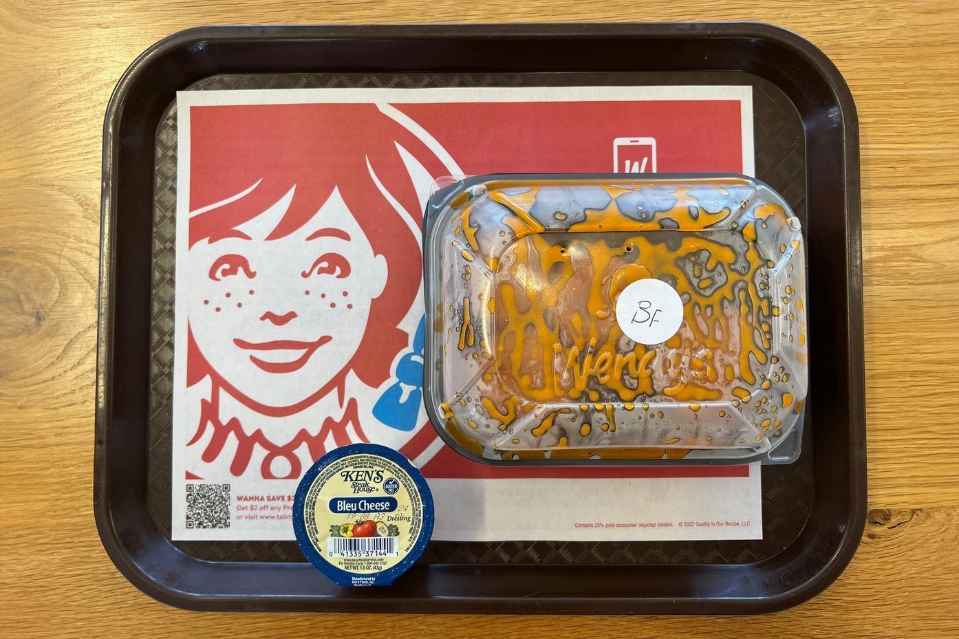 Wendys Saucy Nuggs in container on tray, buffalo