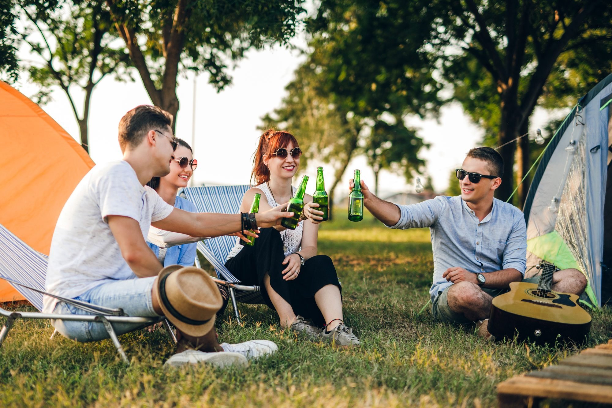 Group Of Friends Camping In The Nature Drinking Beer