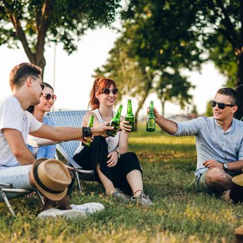 Group Of Friends Camping In The Nature Drinking Beer