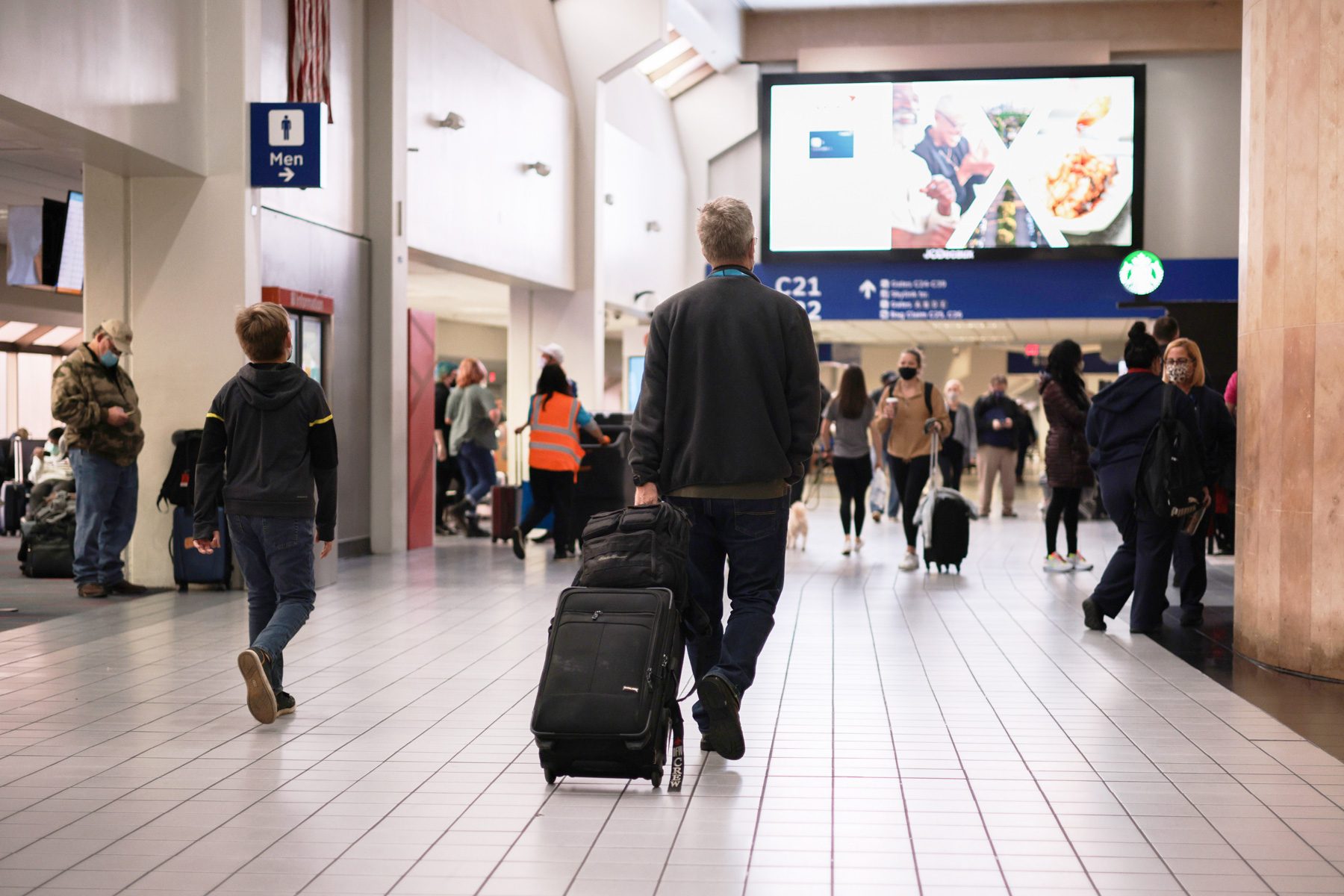 People walk through the Dallas/Fort Worth International Airport