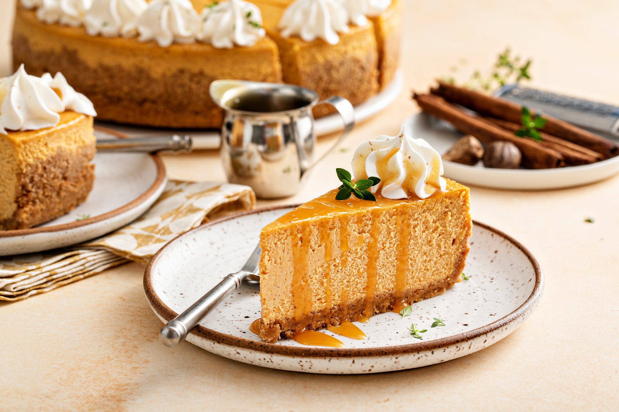 Pumpkin cheesecake with fall spices topped with whipped cream